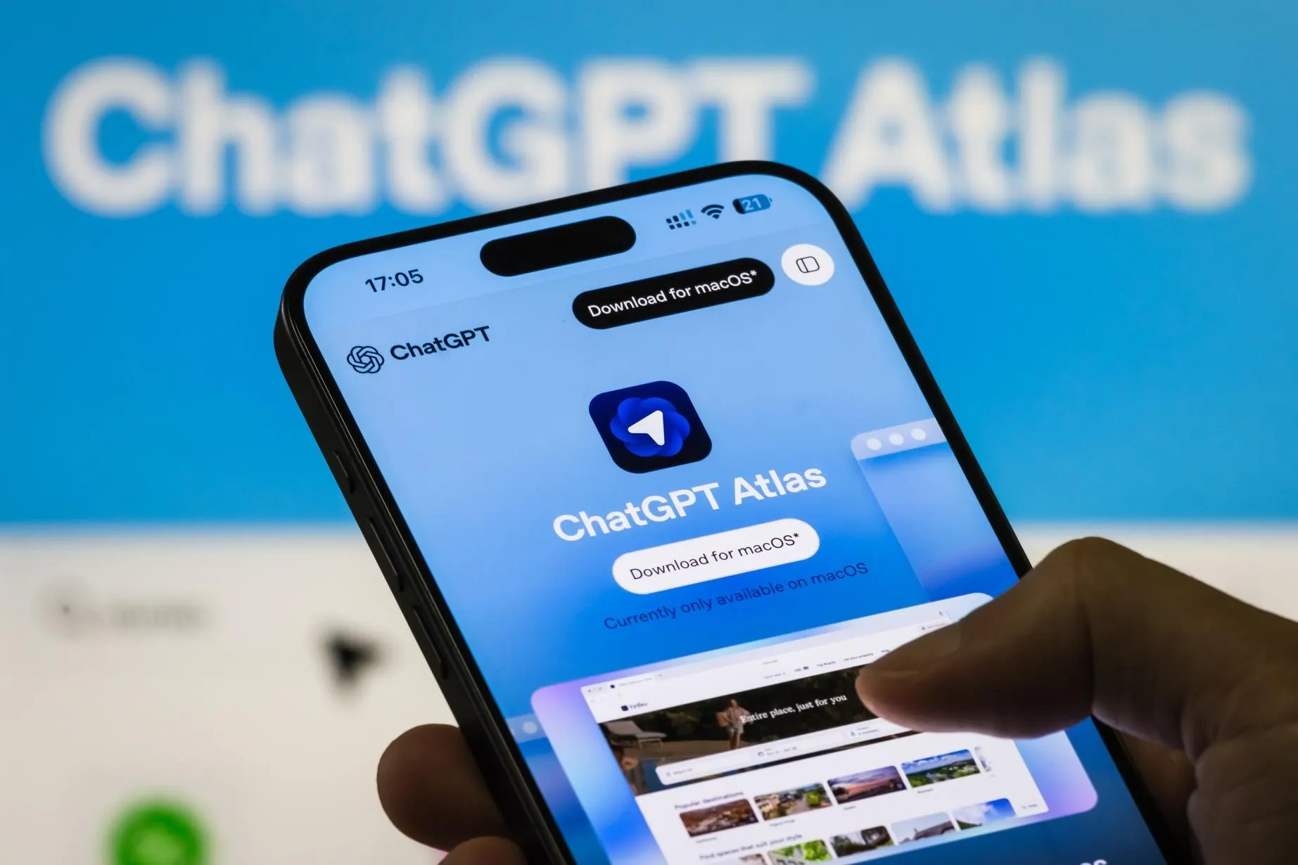 OpenAI Atlas browser interface on laptop screen with warning alert symbol representing prompt injection vulnerability and AI security threats.