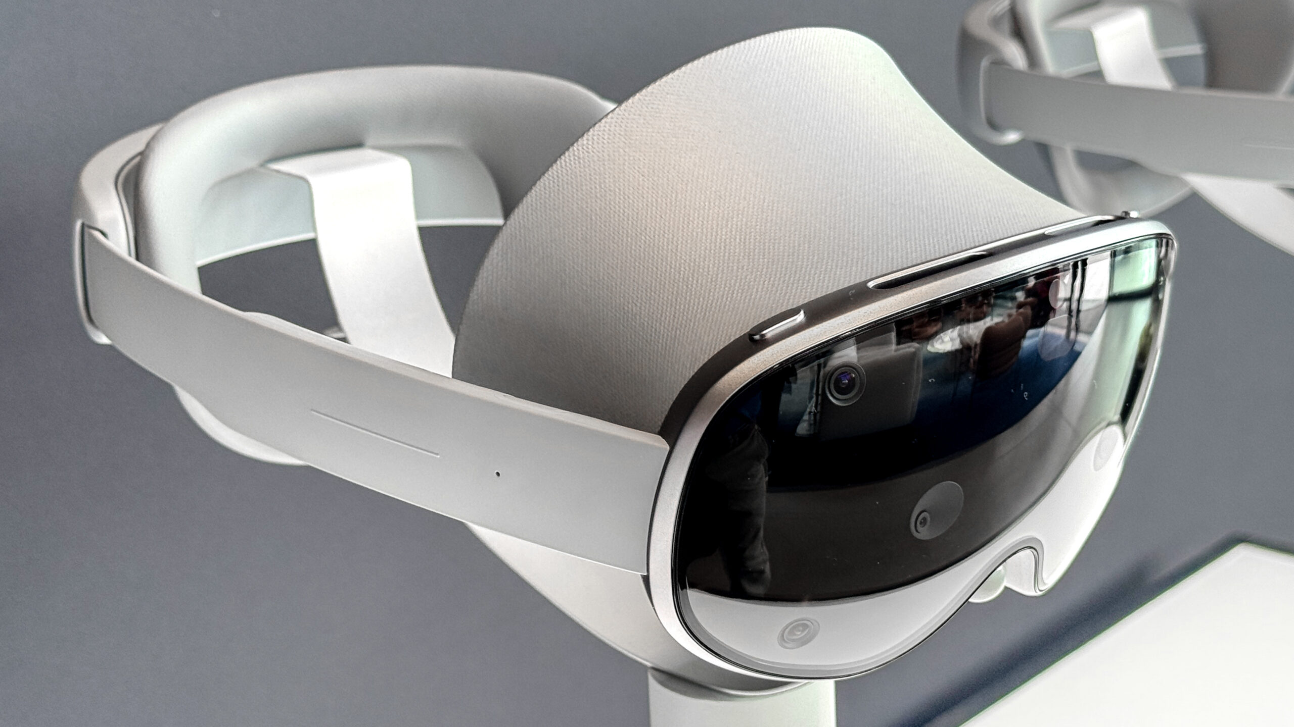Front view of the Samsung Galaxy XR headset showcasing its futuristic design and high-resolution display. The Google ARCore integration brings enhanced augmented reality features to the Samsung Galaxy XR headset Gaming on the Samsung Galaxy XR headset, providing an immersive experience with augmented and virtual reality Virtual business meeting using the Samsung Galaxy XR headset, demonstrating its productivity applications