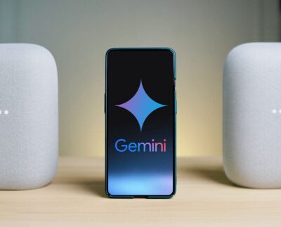 Google Gemini AI interface displayed on a smart TV screen. User interacting with Gemini voice assistant using Google TV remote. List of supported TVs and streaming devices receiving Gemini update. Google TV home screen showcasing Gemini-powered content recommendations. Close-up of a TCL smart TV running Gemini AI features. Family using Google Gemini to find movies and control smart home devices. Google executive presenting Gemini AI expansion for TVs at a tech event.