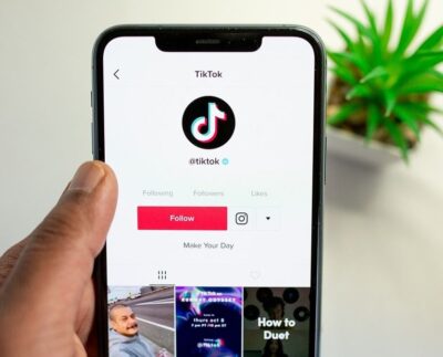 "TikTok's digital well-being tools for managing screen time and promoting healthy habits." "A teen setting up screen time limits on TikTok for better digital health." "Doomscrolling on TikTok is reduced with new break reminders for users." "Family Pairing feature on TikTok helps parents manage teen's screen time." "TikTok sleep reminder helping users disconnect for better sleep hygiene." "Teens adjusting their TikTok screen time settings using the new well-being features." "Illustration showing TikTok's digital well-being features designed for teens."