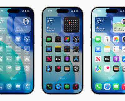 Close-up of iPhone screen showing Liquid Glass design with translucent app icons on iOS 26.1