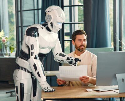 "Humanoid robot learning to perform human-like tasks in a lab." "Japanese robot interacting with humans in a collaborative workspace." "Physical AI robot picking up objects with dexterity and precision." "Robots assisting nurses and patients in a Japanese hospital." "Industrial robot performing complex assembly tasks alongside humans." "AI robot observing humans to learn new skills and movements." "Future of human-robot collaboration in Japanese workplaces."